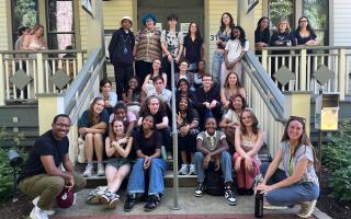Theatre students sitting on steps of Chautauqua Theater